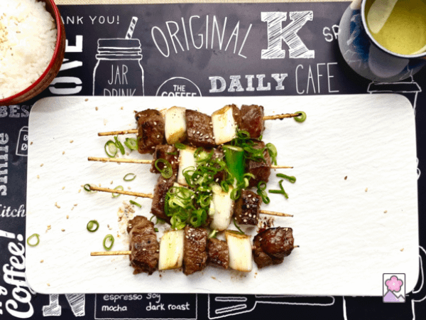 Delicious Miso Marbled Beef Skewers served with rice and green tea
