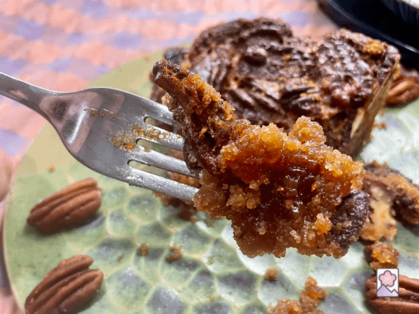 A bite of scrumptious Southern Pecan Pie on a fork