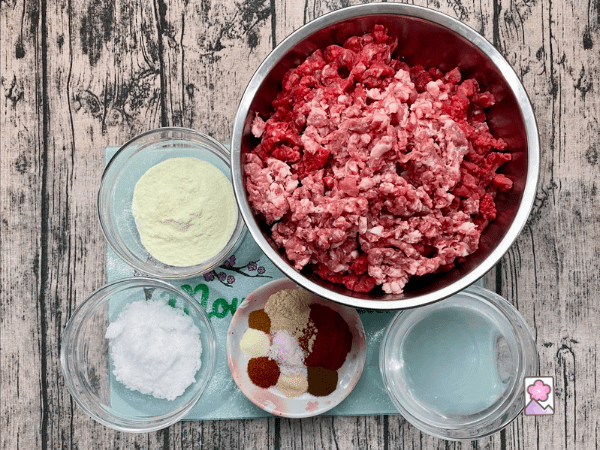 Homemade bologna ingredients includes fresh ground meat, spices, and powdered milk