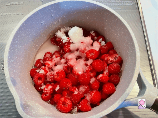 Raspberries and White Sugar combines with water in a saucepan