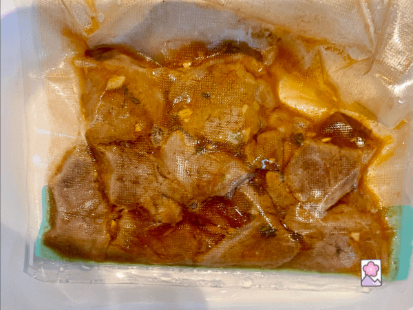 Roast beef strips in the sous vide bag after cooking
