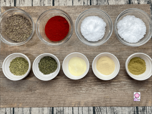 Sweet Italian Sausage Spice Ingredients lined up on a plank