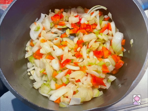 Sauteeing onions, celery, garlic and red pepper in olive oil. All in a large stock pot