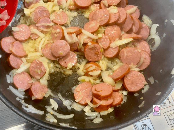 Polish Kielbasa and Sauerkraut Skillet preparation - onions and kielbasa in the skillet