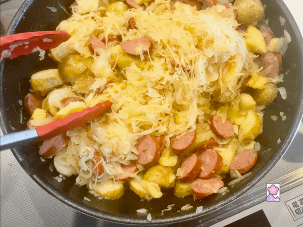 Sauerkraut stirred into the skillet