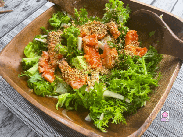 Japanese Salad with Onion Vinaigrette Dressing in a wooden bowl ready to be served.