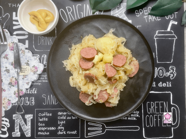 Polish Kielbasa and Sauerkraut Skillet is served with some hot and sweet mustard on the side