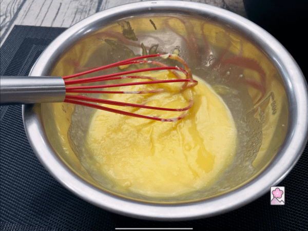 Whisking the wet ingredients in a metal bowl