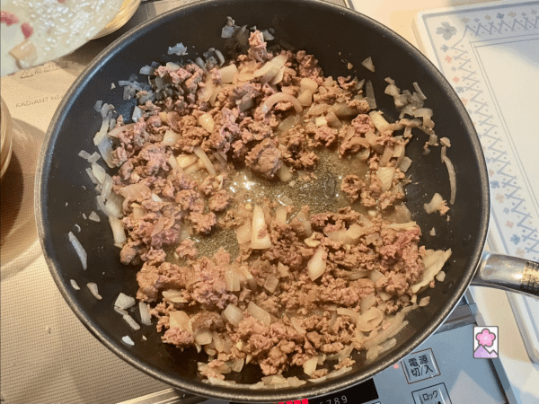 Lab, onions and garlic in a skillet cooked to a golden brown