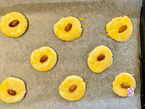 8 Chi see Almond cookies on a baking sheet and ready for cooking