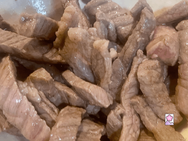 Tender beef strips, lightly seared and set aside