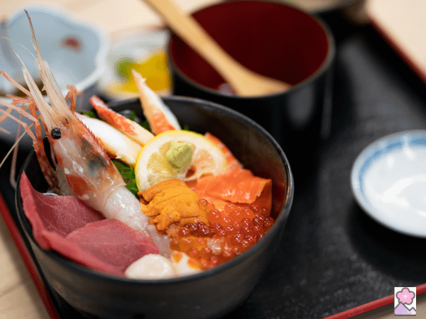 Seafood in a rice bowl on a bed of rice