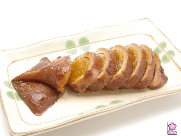 A squid cut into slices and stuffed with rice