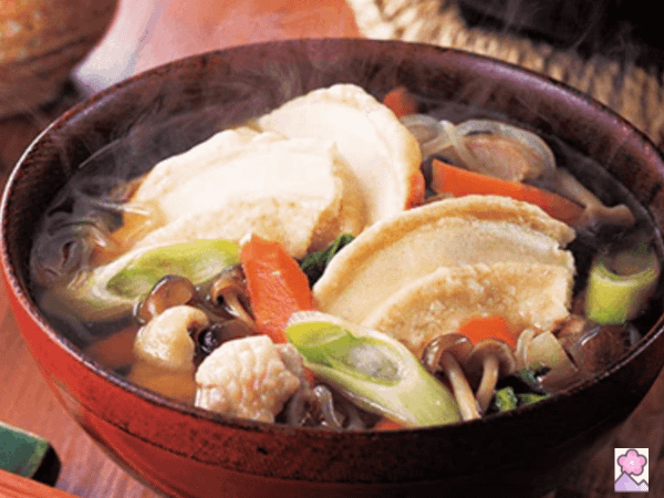 Aomori Senbei Jiru- rice cracker soup in a wooden soup bowl
