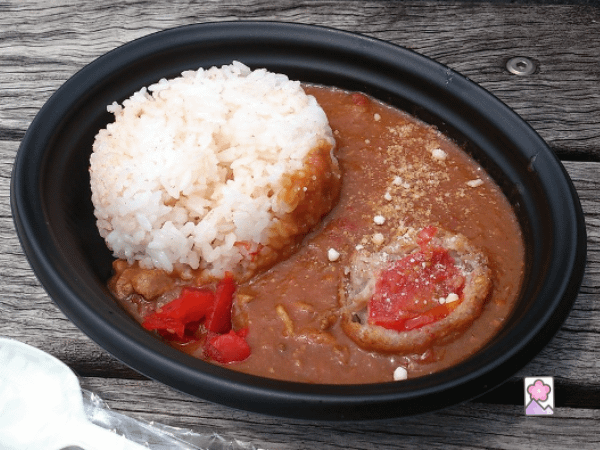 Savory Kitamoto tomato curry in a bowl with a scoop of white rice