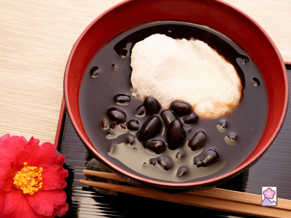 zenzai - a sweet dessert with anko beans and mochi in a bowl