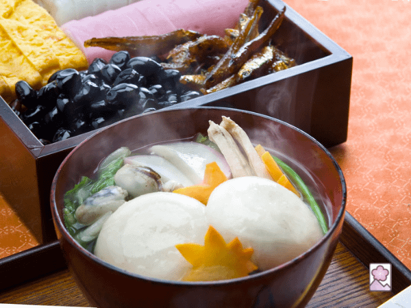 Ozono soup with mochi, and osechi box is in the background