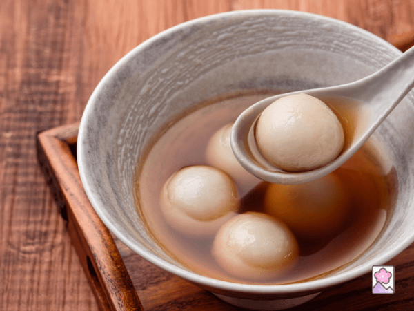 Tangyuan Sesame Dumplings in a bowl of syrup
