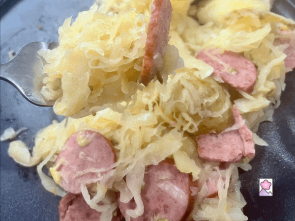 A forkful of Polish Kielbasa and Sauerkraut Skillet