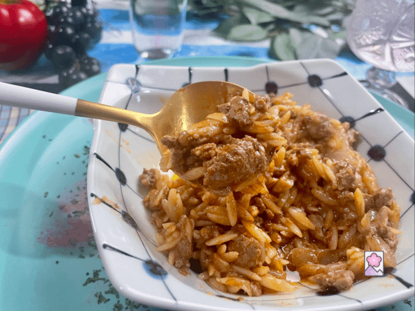 A spoon of Youvetsi features orzo and lamb